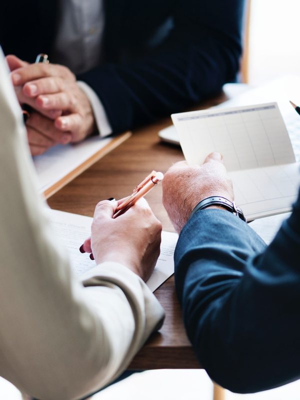 Consultants assisting a pensioner with life certificate documents