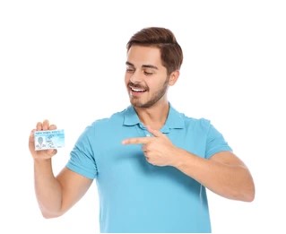 Happy man holding his verified driving licence card